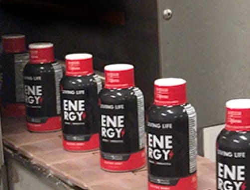 2oz energy shots coming out from shink tunnel at Nutrition Laboratories.