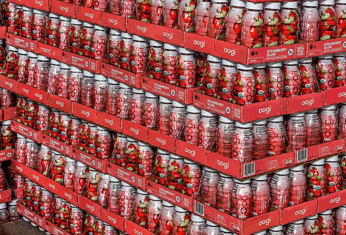 Beverages packed in trays for Costco and stacked on pallets for distribution at Nutrition Labs 