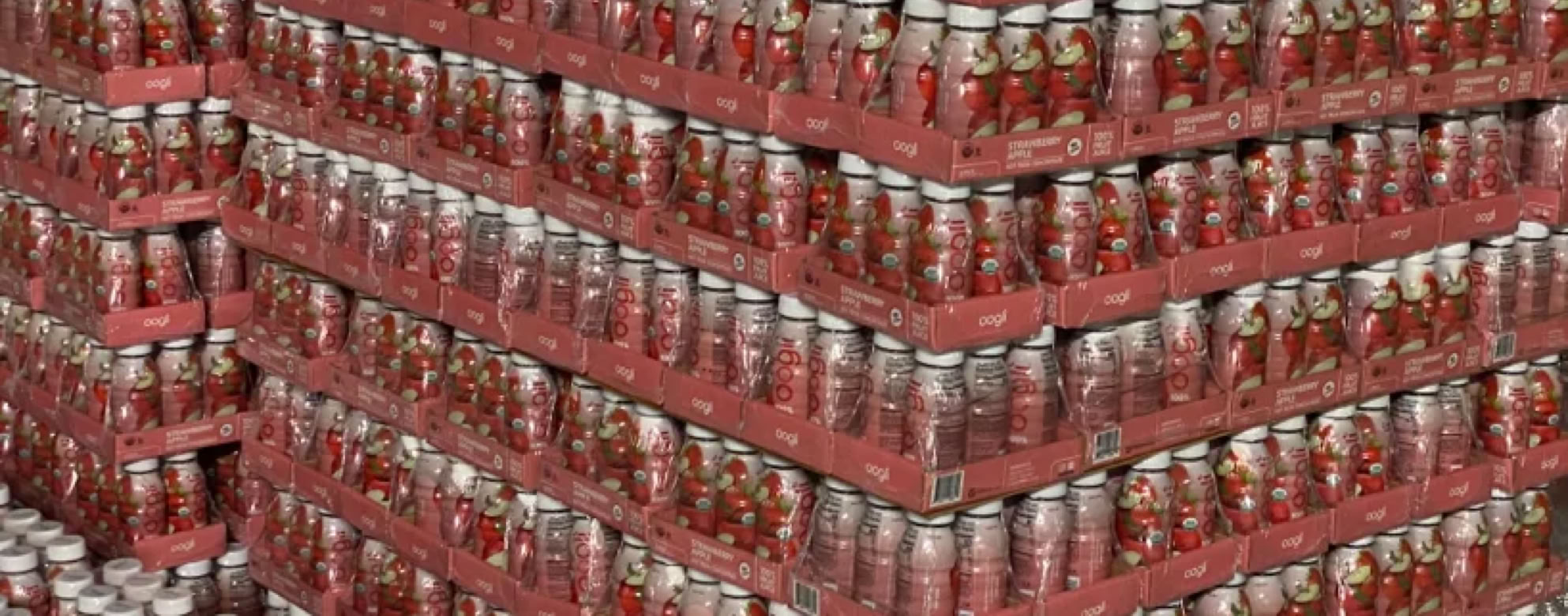 Beverages packed in trays for Costco and stacked on pallets for distribution at Nutrition Labs 